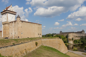 Fototapeta na wymiar View of Estonian Narva Castle, Russian Ivangorod Fortress and border river Narva.