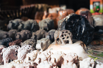 Hand carved marble elephant figurines for sale at Dilli Haat, a craft bazaar market in New Delhi...