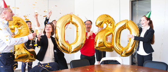 Business people are celebrating New Year 2020