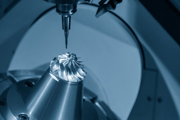 The  5-axis CNC milling machine  cutting the hi-precision automotive  by solid ball endmill tools....