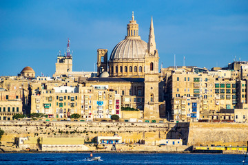 Fototapeta na wymiar Two Churches in the City of Valletta, Malta, facing Marsamxett harbour.