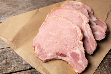 Smoked pork chops on wooden background