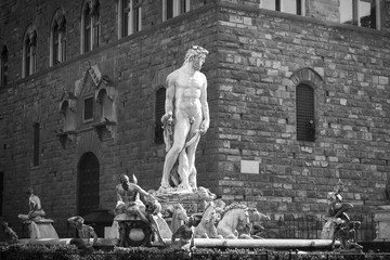 Black and white shot of the Fountain of Neptune, sculpted by Bartolomeo Ammannati in around 1560, and preserved in Florence, Italy