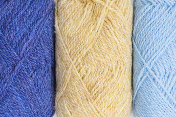 background of balls of shetland wool in blue and beige