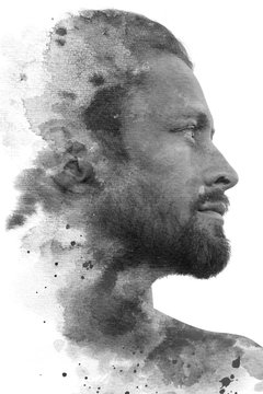 Paintography. Double exposure profile portrait of an attractive male model combined with hand drawn ink painting