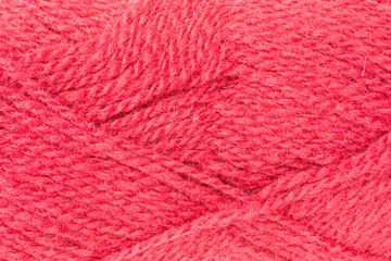 background of ball of shetland wool in red