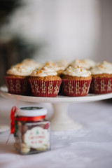 Christmas muffins on the table with holiday lights.