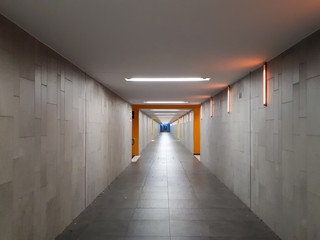 empty underground passage at train station with vanishing point in Bad Friedrichshall, Germany