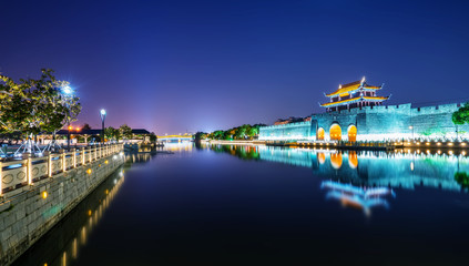 Fototapeta na wymiar Night view of ancient city wall of pingmen, Suzhou..