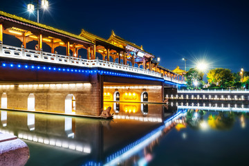 Fototapeta na wymiar Night view of ancient city wall of pingmen, Suzhou..