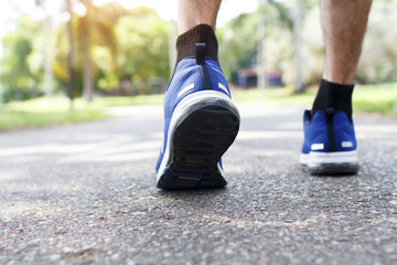 Fototapeta na wymiar closeup of male running walking shoes. Work out concept, step walk
