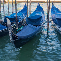 Fototapeta na wymiar Venice, Italy. Moored gondolas, traditional Venetian rowing boats