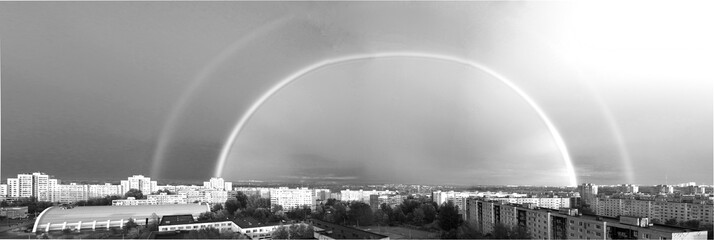 Real rainbow in the sky over the city of Kazan white and black