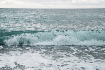 Naklejka na ściany i meble Beautiful Sea Splashing Wave on the Beach. Seascape.