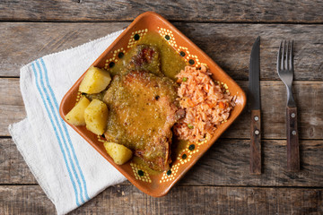 Mexican smoked pork chops with green sauce and rice