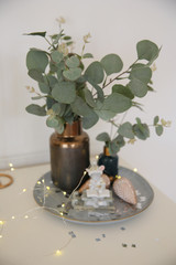 Christmas table in the kitchen with a festive Christmas tree decorated with toys.