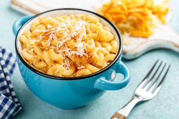 Mac and cheese. traditional american dish macaroni pasta and a cheese sauce - 303373837