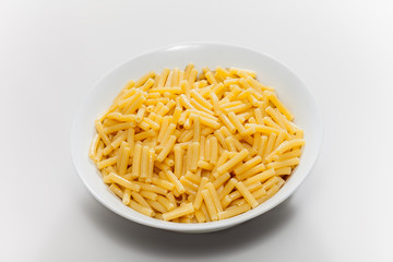 isolated pasta in plate on white background