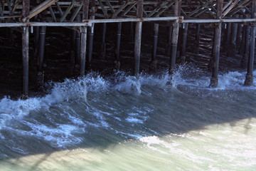 Waves crashing against pier