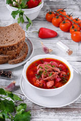 Borscht soup with meat in a white bowl. Ukrainian cuisine meal