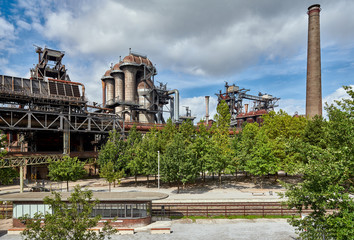 Fototapeta na wymiar Industrial factory in Duisburg, Germany. Public park Landschaftspark, landmark and tourist attraction.
