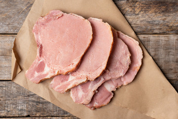 Smoked pork chops on wooden background