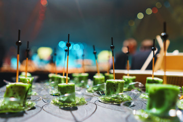 Canapes with cheese and vegetables. Catering and guest meals during the event.