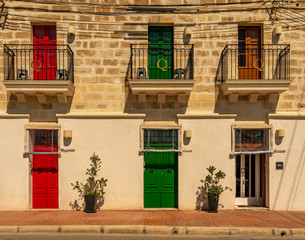Obraz na płótnie Canvas colorful doors of a building at the harbor of marsaxlokk on malta