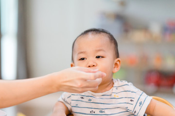 Little baby boy un accept to drink medicine syrup with syringe.
