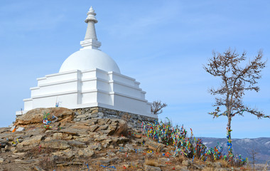 The Buddhist Stupa of Enlightenment in winter in sunny day at Ogoy Island, Baikal Lake , Russia