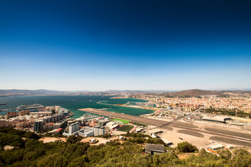 Gibraltar airport runway and La Linea de la Concepcion in Spain. View from the top of the rock of...
