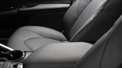 beautiful leather car interior design. luxury leather seats in the car. Black leather seat covers in car. artificial leather rear seats in the car.