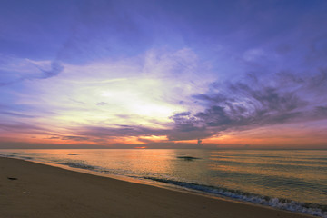 Fototapeta na wymiar Beautiful sunset sky over tropical beach and sea