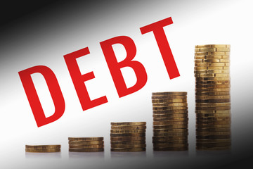 Growing debt. Piles of coins and the inscription duty.  Increasing credit indebtedness