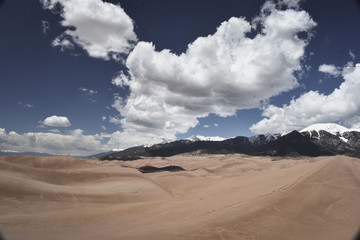 Fototapeta na wymiar dunes, mountains, and sky