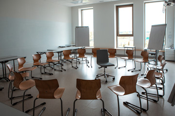 Empty classroom. Modern classroom. Convenient audience for classes. Chairs stand in a circle.