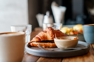 breakfast with eggs and coffee and croissant - Powered by Adobe