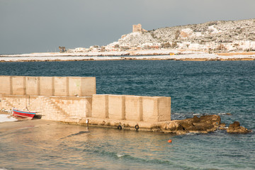 Ionian coast after a exceptional snowfall, Salento, Italy