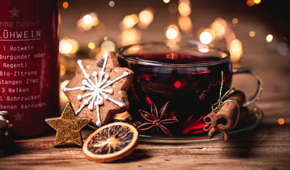 red mulled wine, hot drink in christmas decoration background 
