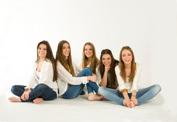 Portrait of a group of young girl friends seated