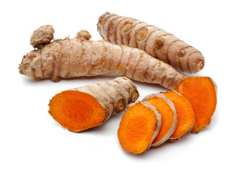 Fresh turmeric with slices isolated on white background