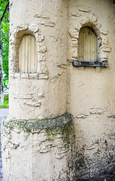Imitation of castle wall with tower window. Old castle on children playground