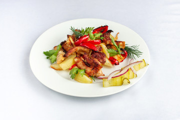 Fried potatoes with lard, bell pepper, parsley, dill and pickled cucumber.