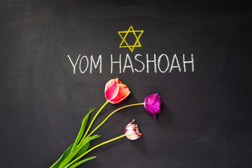 Fototapeta na wymiar Star of David and inscription on chalkboard Yom HaShoah (in English as Holocaust Remembrance Day, or Holocaust Day)