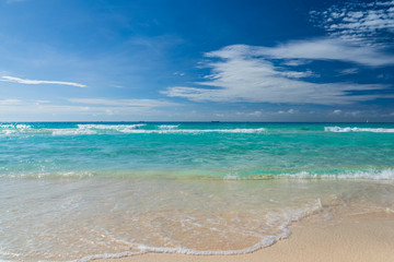 Beautiful marine view on caribbean sea coast line with clean wavy surf ocean water on sandy beach at sunny day