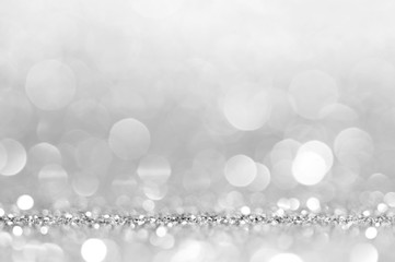 Silver white abstract light grey background, shining lights, sparkling glittering Christmas lights....