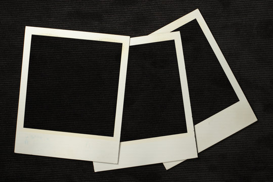 Empty photo frames for photos on a black background.