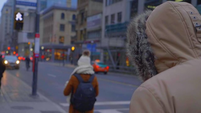People walking outside in a downtown city on cold winter day 01
