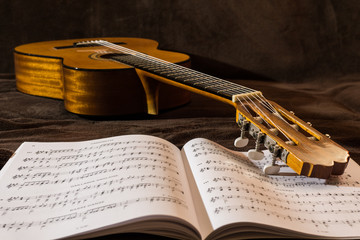 Guitar on sheet music notes