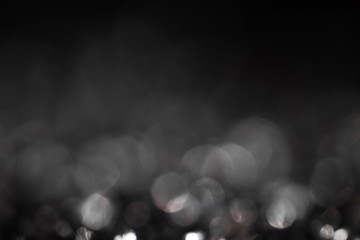 Monochrome vintage abstract background with big bokeh defocused lights.